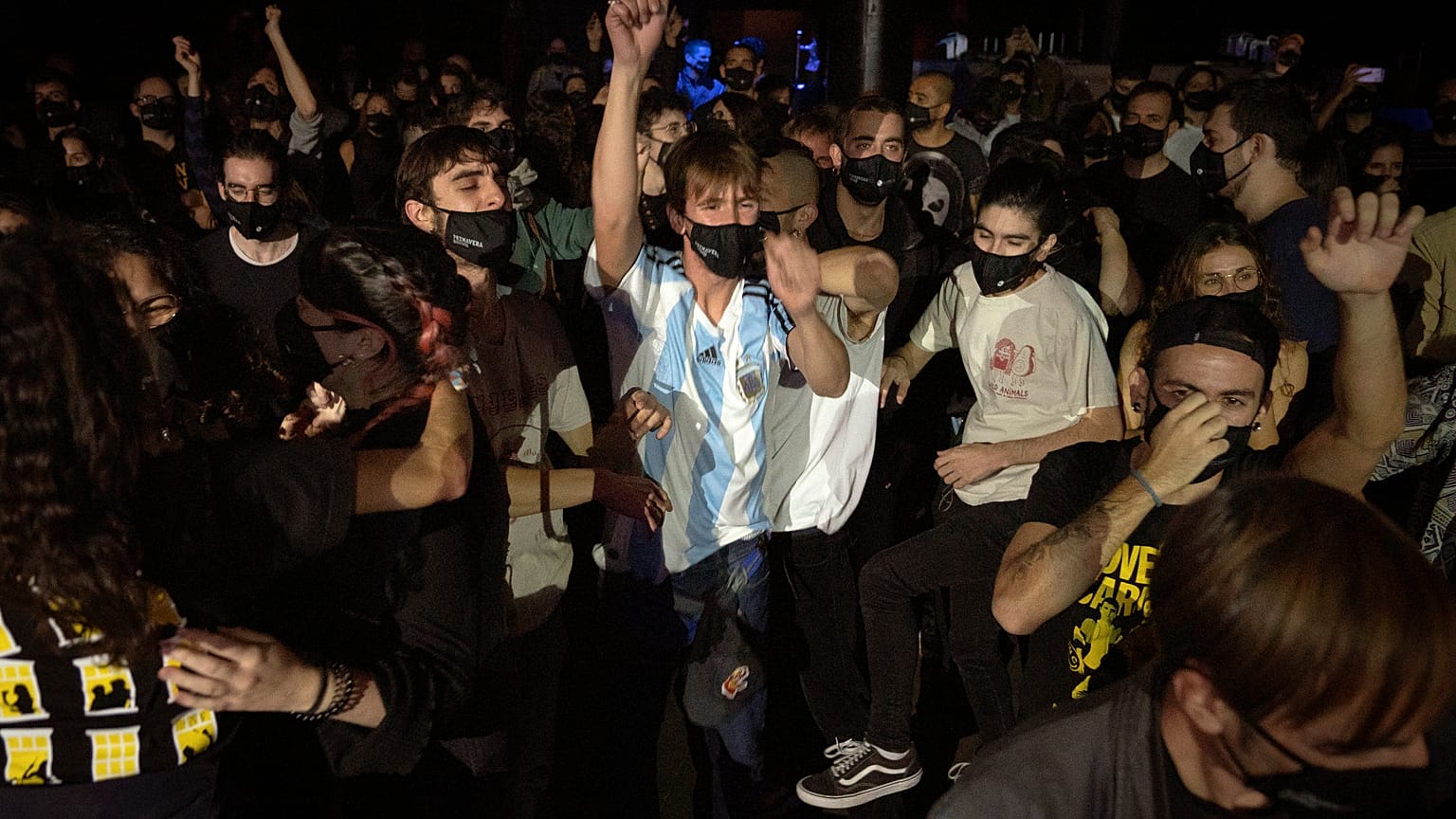 Volunteers dance during a concert in Barcelona, Spain, Saturday, Dec. 12, 2020. 