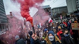 Protesters take part in demonstration of Women's Right movement to mark the anniversary of the introduction of martial law in communist Poland.