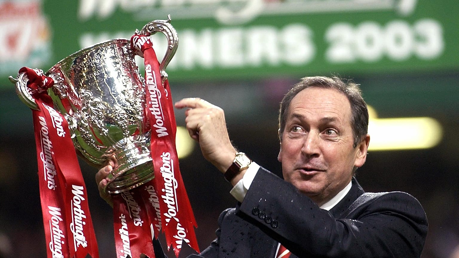 Gerard Houllier celebrates victory for Liverpool over Manchester United in the Worthington (League) Cup Final, March 2, 2003.