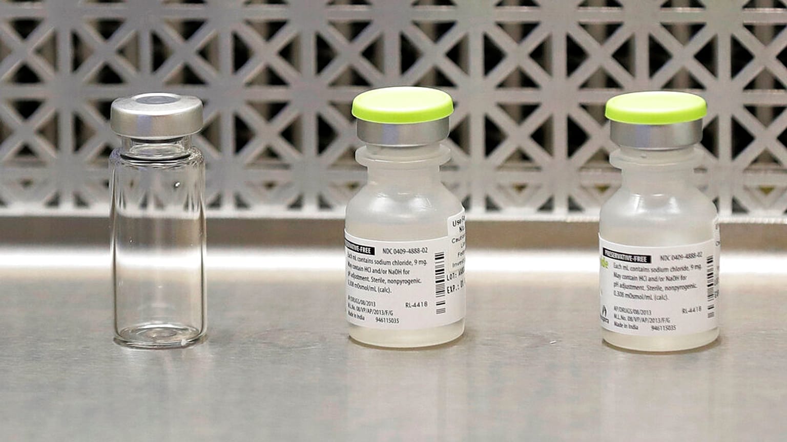 file photo shows vials used by pharmacists to prepare syringes 