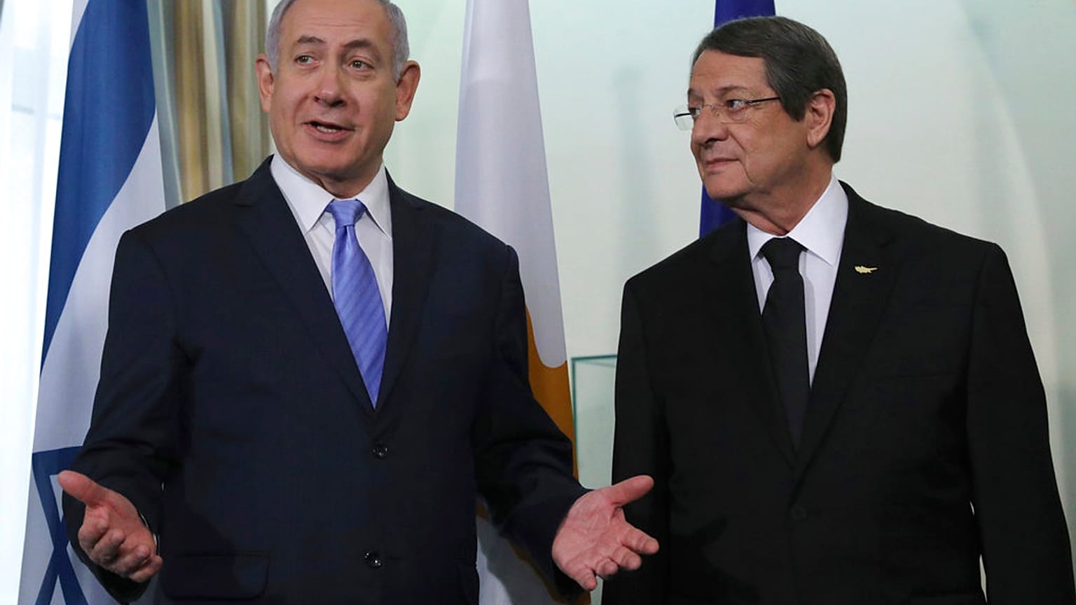 Cyprus' president Nikos Anastasiades, left, talks with Israeli Prime Minister Benjamin Netanyahu