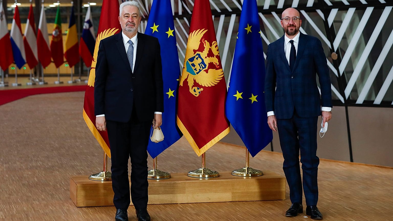European Council President Charles Michel, right, and Montenegro Prime Minister Zdravko Krivokapic pose for photographers before their meeting at the European Council headquar