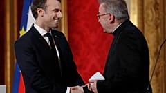 FILE: In this Jan.4, 2018 file photo, French President Emmanuel Macron greets Apostolic Nuncio to France Luigi Ventura during his New Year address to diplomats.