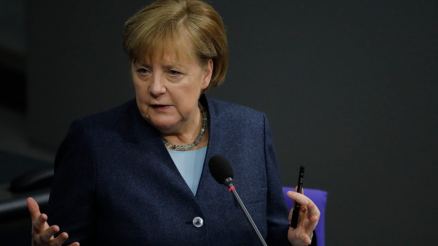 German Chancellor Angela Merkel answers questions of lawmaker about German government's policy at the parliament Bundestag, in Berlin, Germany, Wednesday, Dec. 16, 2020.