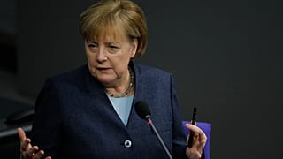 German Chancellor Angela Merkel answers questions of lawmaker about German government's policy at the parliament Bundestag, in Berlin, Germany, Wednesday, Dec. 16, 2020.