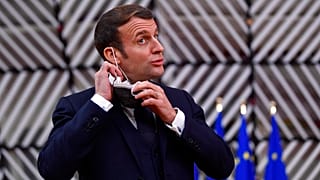 French President Emmanuel Macron reacts as he meets Portuguese Prime Minister Antonio Costa, Wednesday, Dec. 16, 2020 in Paris. 