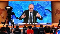 Russian President Vladimir Putin gestures as he speaks via video call during a news conference in Moscow, Russia, Thursday, Dec. 17, 2020. 