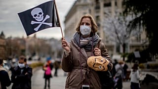 People protest against a law to legalize euthanasia in front of the Spanish Parliament in Madrid, Spain, Thursday, Dec. 17, 2020.