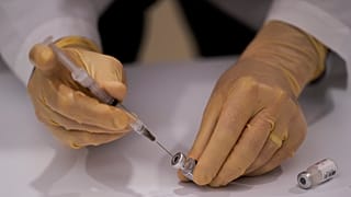 FILE -  Dec. 14, 2020 - David Cheng, director of inpatient pharmacy, prepares the Pfizer-BioNTech COVID-19 vaccine at Kaiser Permanente Los Angeles Medical Center, USA.  