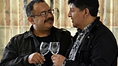 David Aruquipa (L) and Guido Montano make a toast during a press conference after their same-sex union was oficially recognised by the state following a long legal battle in L