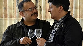 David Aruquipa (L) and Guido Montano make a toast during a press conference after their same-sex union was oficially recognised by the state following a long legal battle in L