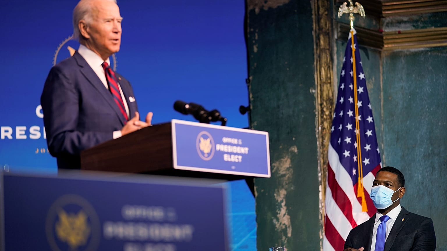 Michael Regan listens as President-elect Joe Biden announces him as his nominee for EPA Administrator at The Queen Theater in Wilmington Del., Saturday, Dec. 19, 2020