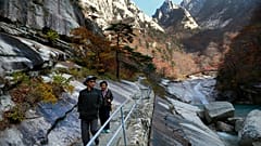 n this Oct. 23, 2018, file photo, local tourists walk on the trail at Mount Kumgang, known as Diamond Mountain, in North Korea