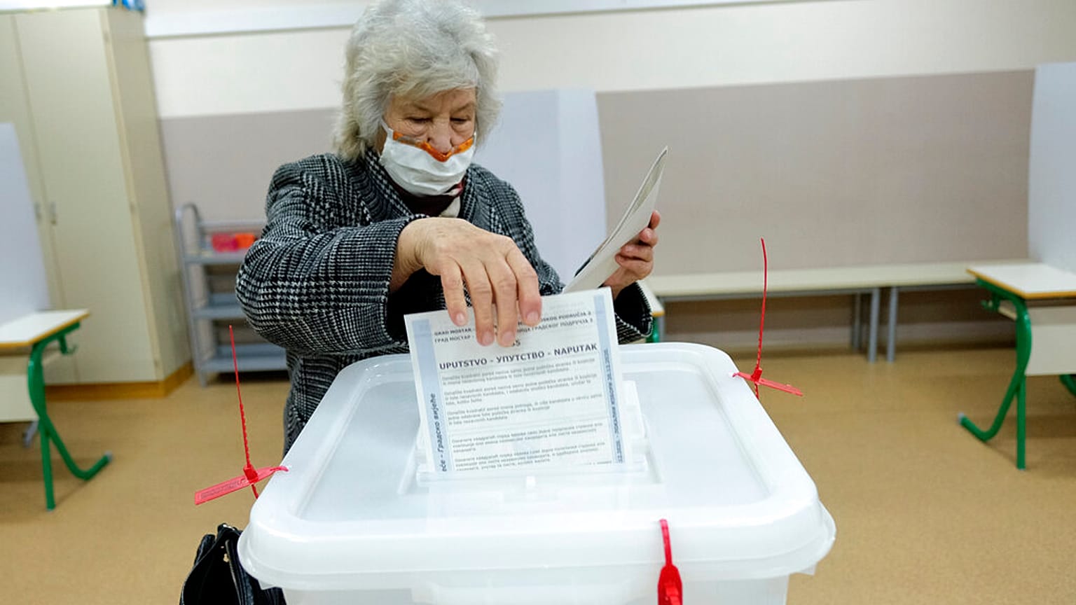 A woman voting for local election in Mostar, Bosnia, on Sunday the 20th of December.