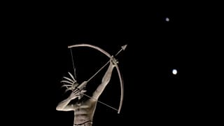 A statue in Kansas, with Saturn (top) and Jupiter in the night sky