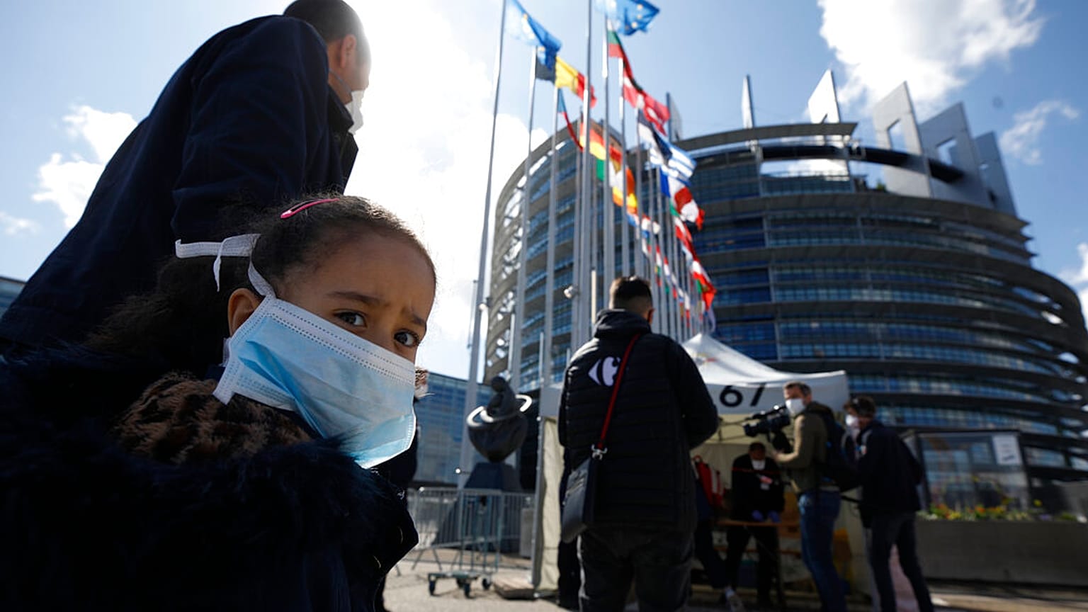 People wait in line to be tested for the COVID-19 outside the European Parliament in Strasbourg, eastern France, Tuesday, May 12, 2020. 