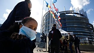 People wait in line to be tested for the COVID-19 outside the European Parliament in Strasbourg, eastern France, Tuesday, May 12, 2020. 
