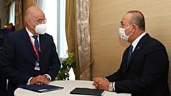 Greek Foreign Minister Nikos Dendias, left, meets with Turkey's Foreign Minister Mevlut Cavusoglu