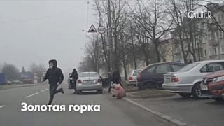 Protesters running away from riot police