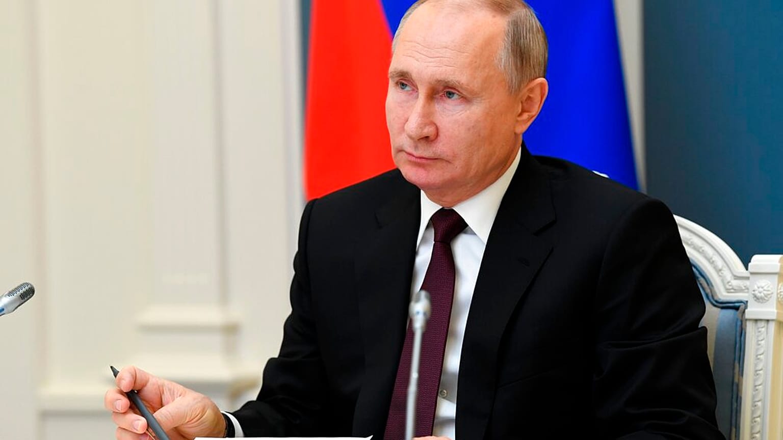 Russian President Vladimir Putin attends a meeting to mark a memorandum of cooperation on the fight against the coronavirus