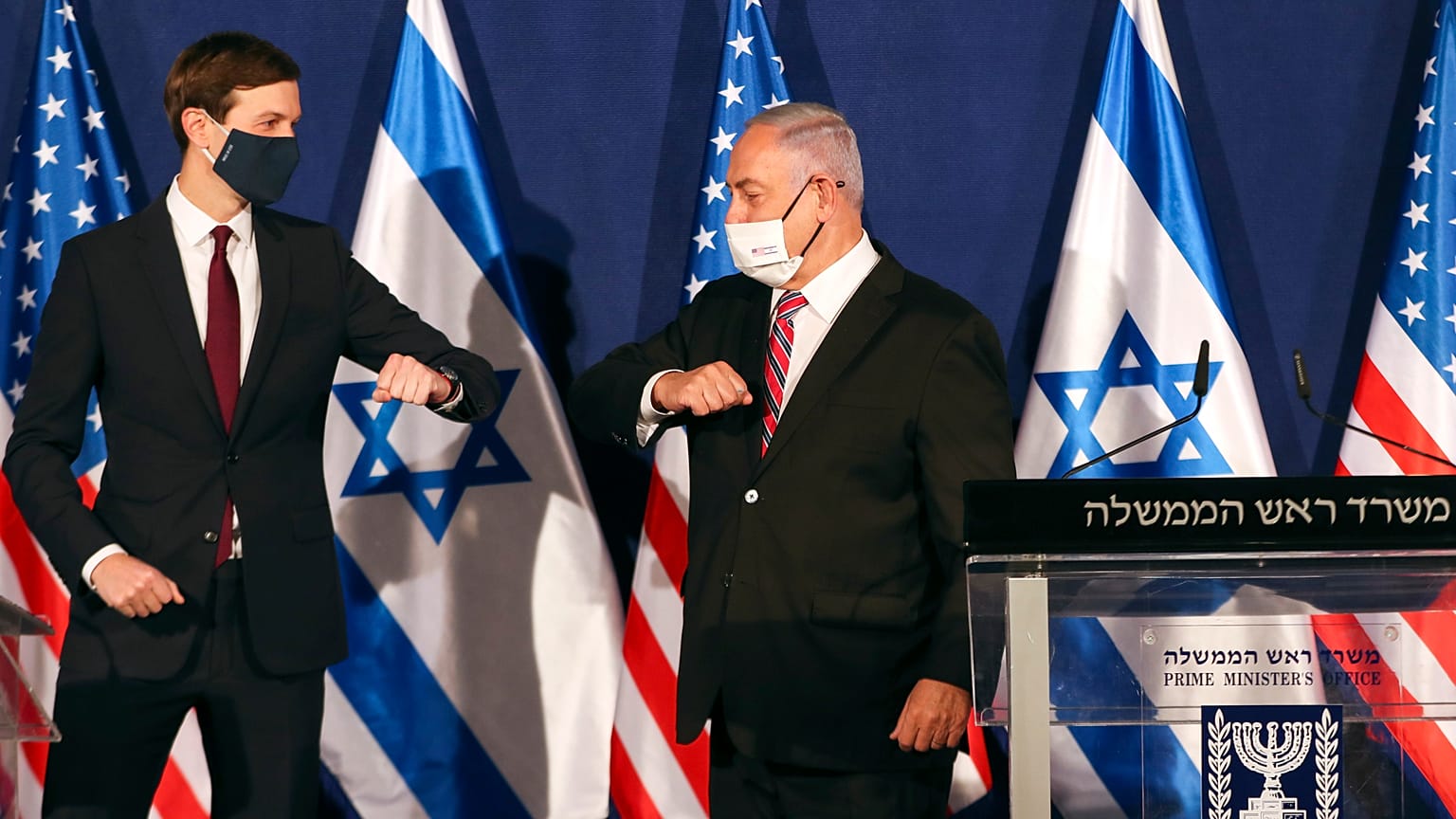 White House senior adviser Jared Kushner, left, elbow bumps Israeli Prime Minister Benjamin Netanyahu 