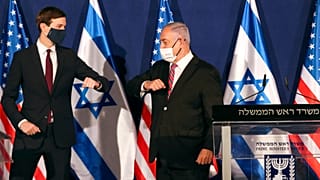 White House senior adviser Jared Kushner, left, elbow bumps Israeli Prime Minister Benjamin Netanyahu 