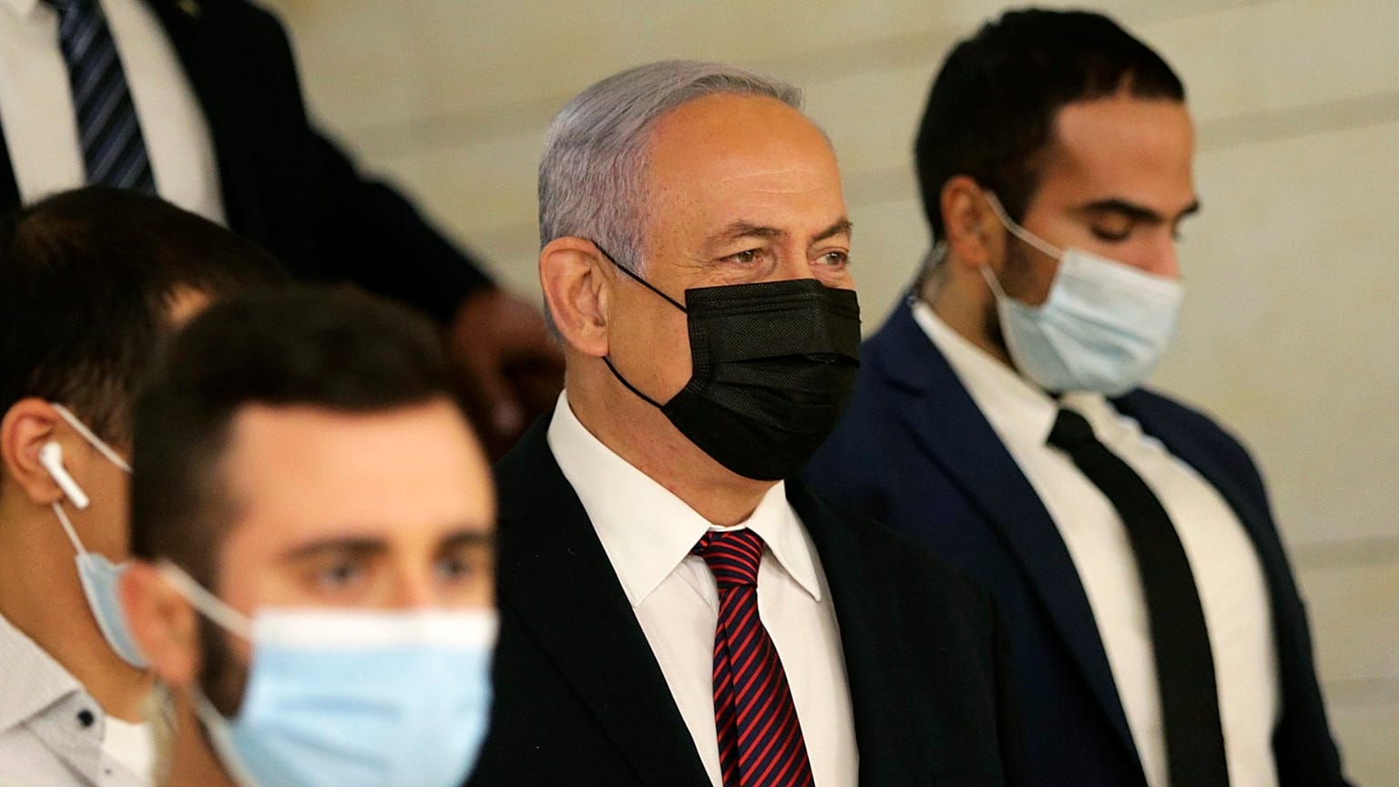 Israeli prime minister Benjamin Netanyahu, centre, arrives at the Israeli Knesset (Parliament).