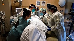 Virus Outbreak US Surge