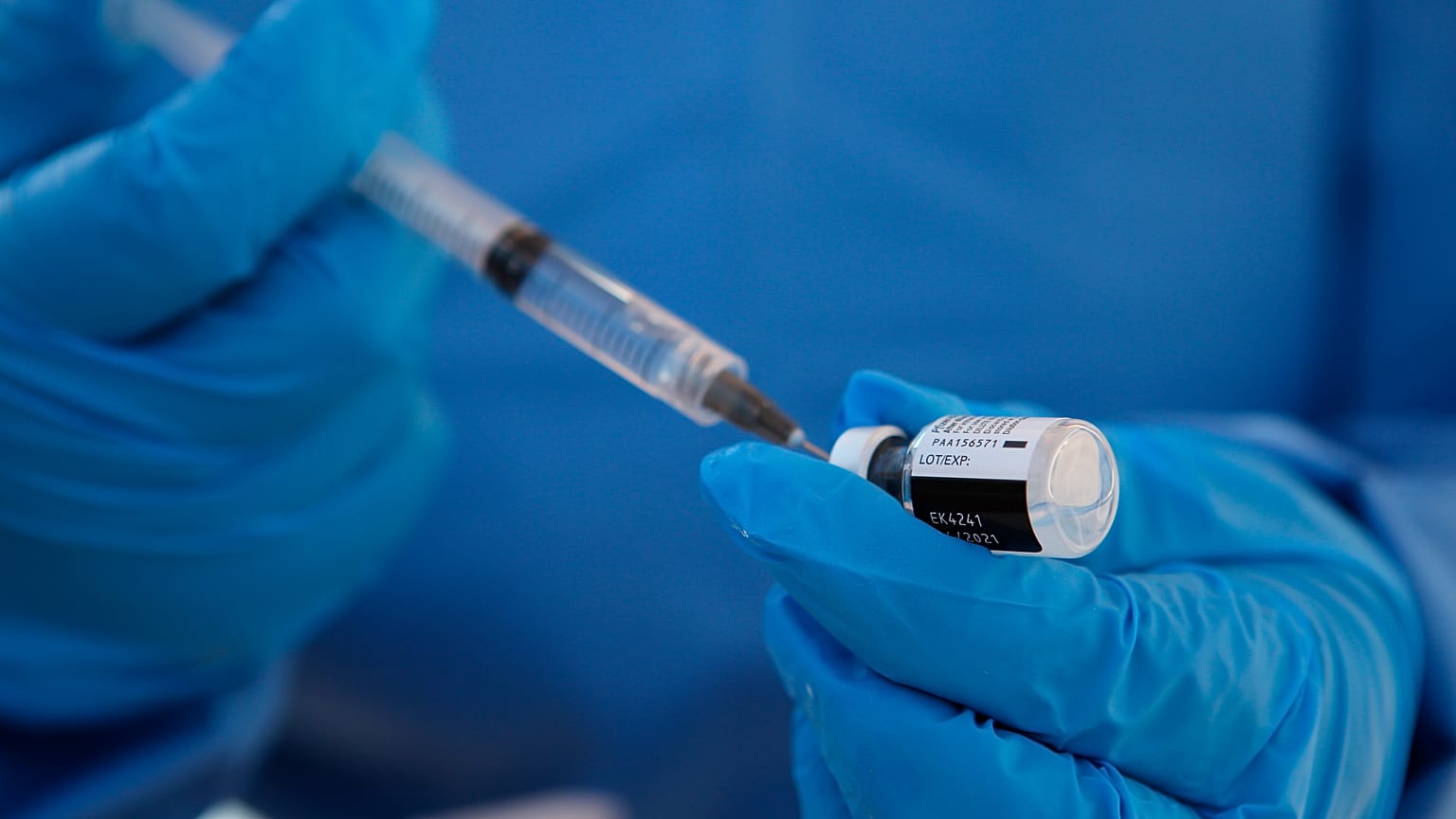 A health worker extracts a dose of the COVID-19 vaccine at the military base in Queretaro, Mexico, Thursday, Dec. 24, 2020. 