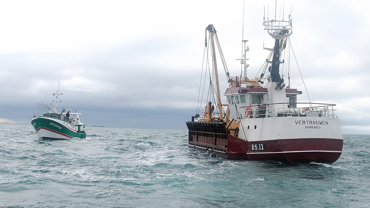 Oct. 8, 2012 photo shows, British fish boat Vertrouwen, right, sailing toward French ship boat Sauvage, left, after one of his sailors was hit by an object