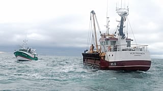 Oct. 8, 2012 photo shows, British fish boat Vertrouwen, right, sailing toward French ship boat Sauvage, left, after one of his sailors was hit by an object