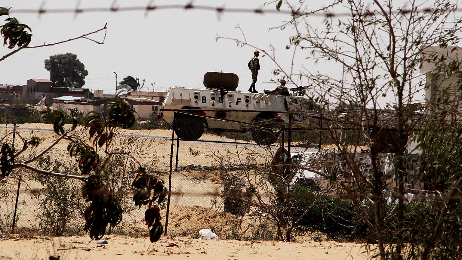 In this Monday, Aug. 6, 2012 file photo, Egyptian border guards patrol near the border with Israel in Rafah, Egypt