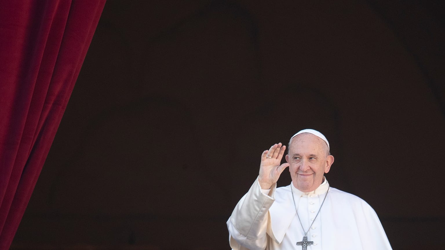 FILE - Pope Francis waves to faithful and pilgrims after he delivered the Urbi et Orbi Christmas' day blessing at the Vatican, Wednesday, Dec. 25, 2019. 
