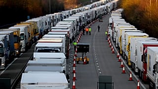 Trucks are parked up on the M20, part of Operation Stack in Ashford, Kent, England, Friday, Dec. 25, 2020. 