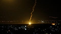 FILE PHOTO - Flares fired from Israeli forces light up the night sky in Gaza City, Monday, Nov. 12, 2018