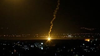 FILE PHOTO - Flares fired from Israeli forces light up the night sky in Gaza City, Monday, Nov. 12, 2018