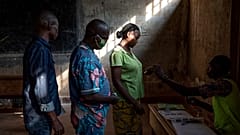 People cast their votes for presidential and legislative elections, at the Lycee Boganda polling station in the capital Bangui, Central African Republic Sunday, Dec. 27, 2020.
