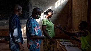 People cast their votes for presidential and legislative elections, at the Lycee Boganda polling station in the capital Bangui, Central African Republic Sunday, Dec. 27, 2020.