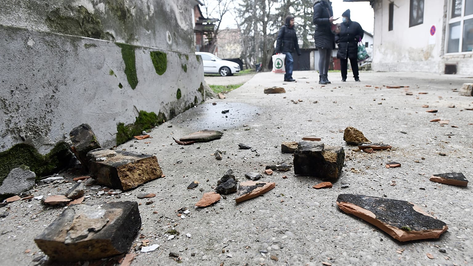 Residents in Sisak inspect damage caused by the earthquake.
