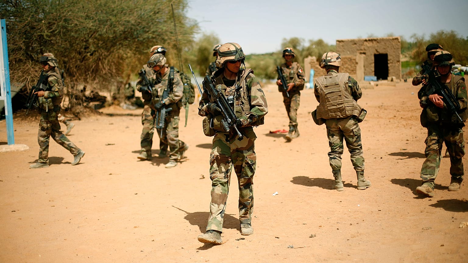 FILE-- In this photo taken Sunday Feb. 10, 2013, French soldiers secure the area where a suicide bomber exploded at the entrance of Gao, northern Mali.