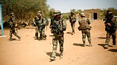 FILE-- In this photo taken Sunday Feb. 10, 2013, French soldiers secure the area where a suicide bomber exploded at the entrance of Gao, northern Mali.