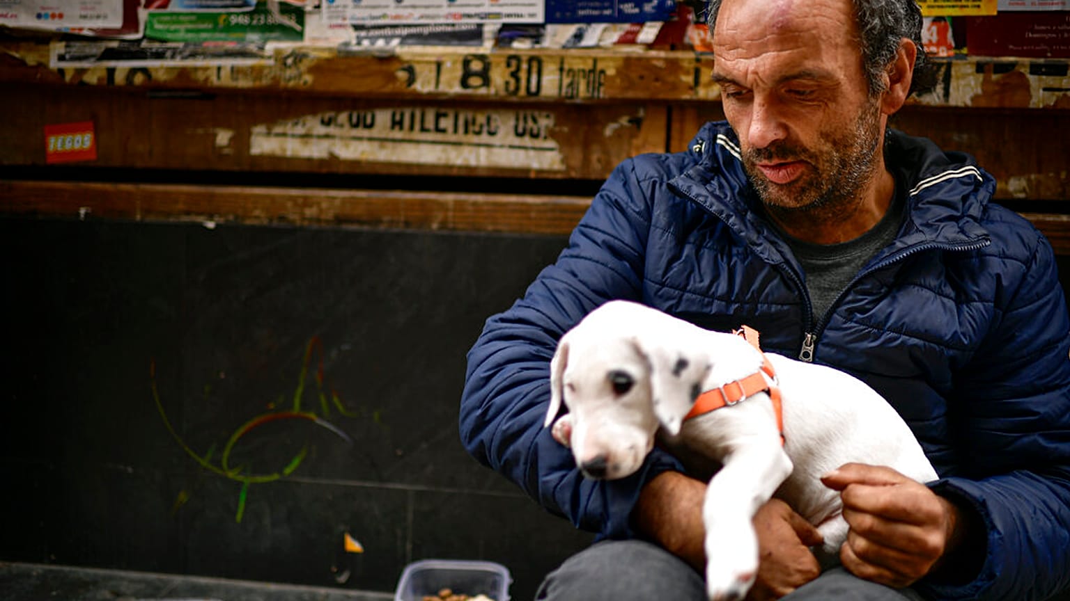 Vicente Mata, a 41-year-old homeless man, begs for money on an empty Estafeta street during lockdown to prevent the spread of coronavirus, in Pamplona, northern Spain