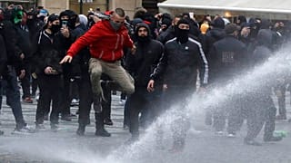 Water canon is used against demonstrators as they gather to protest against the COVID-19 restrictive measures at Old Town Square in Prague, Czech Republic