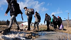 Migrants leave to be relocated from the Lipa camp northwestern Bosnia, near the border with Croatia, Bosnia, Tuesday, Dec. 29, 2020.