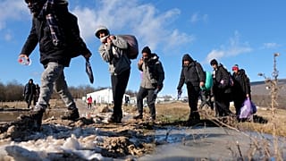 Migrants leave to be relocated from the Lipa camp northwestern Bosnia, near the border with Croatia, Bosnia, Tuesday, Dec. 29, 2020.