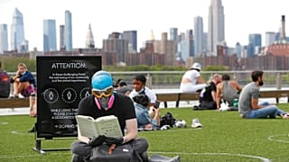 Social distancing at Domino Park in the Williamsburg borough of Brooklyn, Monday, May 18, 2020, in New York.
