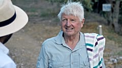 Stanley Johnson, father of Britain's Prime Minister Boris Johnson, speaks with a local reporter, outside his Villa Irene in Horto village, Mount Pelion