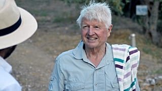 Stanley Johnson, father of Britain's Prime Minister Boris Johnson, speaks with a local reporter, outside his Villa Irene in Horto village, Mount Pelion