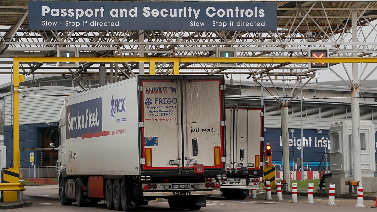 Lorries pass the customs checkpoint in Folkestone, England, Friday, Jan. 1, 2021, the first day after the UK left the EU's single market for people, goods and services.