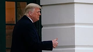 President Donald Trump gestures to supporters as he walks onto the South Lawn of the White House in Washington, Saturday, Dec. 5, 2020.